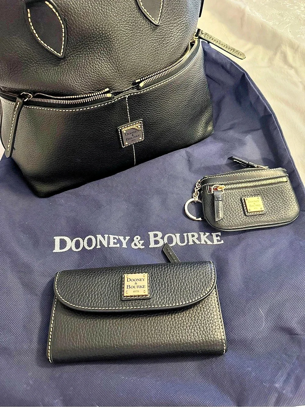 Dooney & Bourke Black Pebble Leather Wallet with Red Interior - Like New